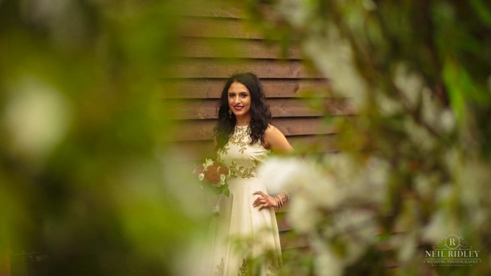 Merrydale Manor Wedding Photographer - Bride posing with bouquet 